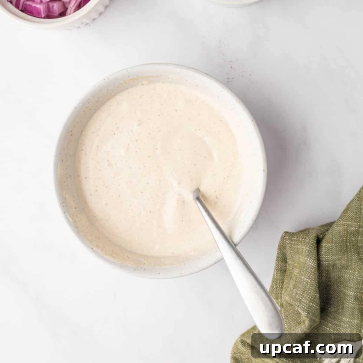 Pasta salad dressing in a bowl.