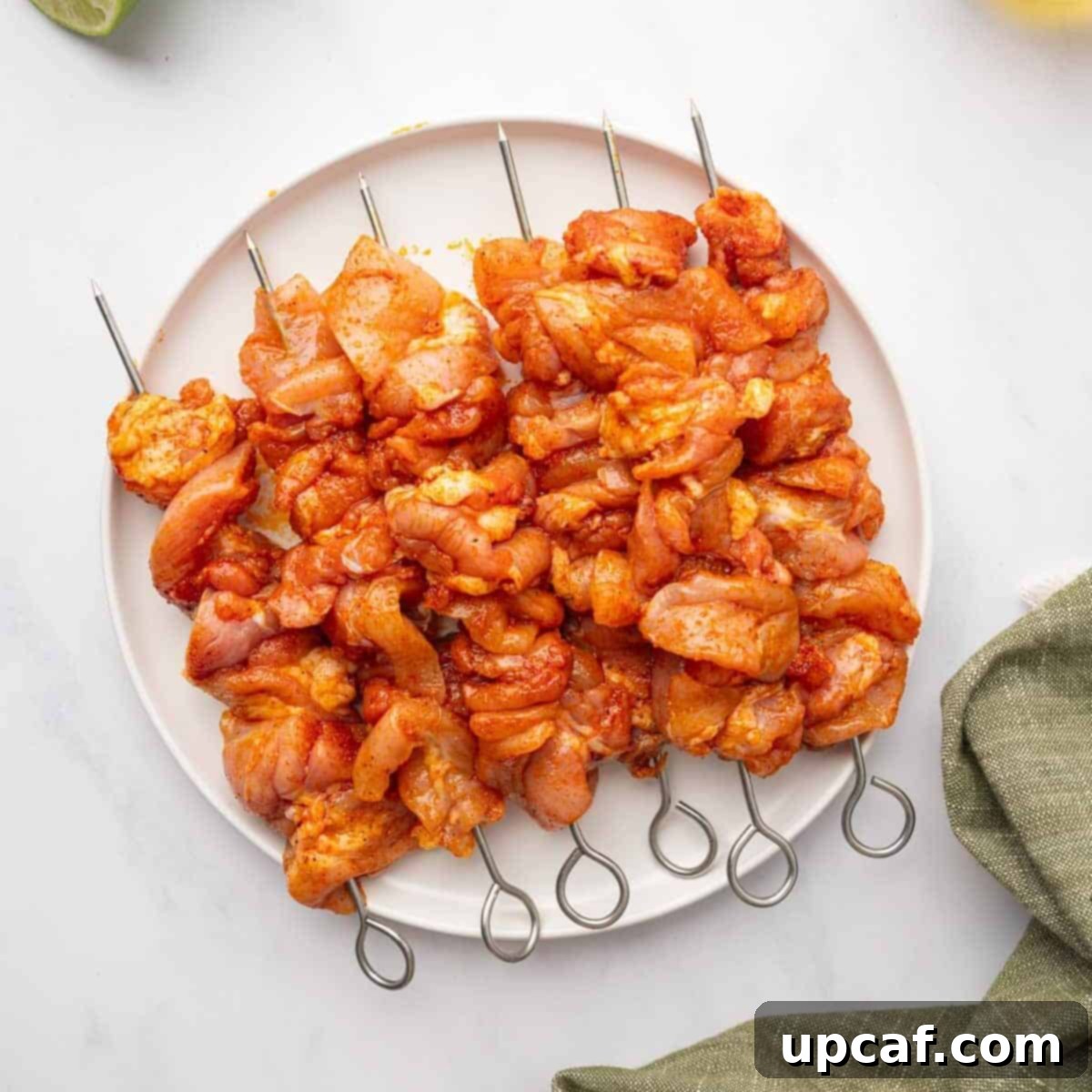 Dynamite Chicken Skewers 5 Marinated chicken pieces expertly threaded onto skewers, ready for the grill.