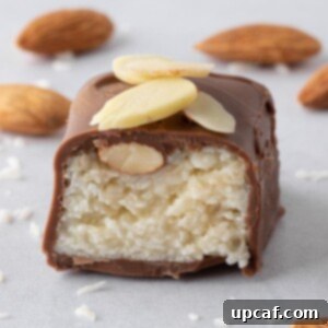 Island Coconut Chocolate Dream 12 A coconut and almond filled candy bar is cut in half so you can see the filling.
