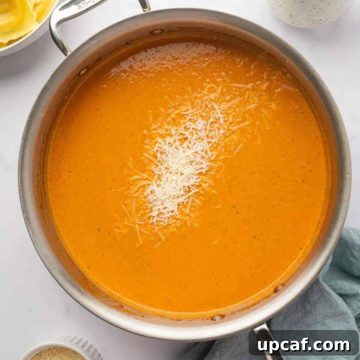 Decadent Lobster Ravioli Sauce 7 Fresh parmasan cheese is stirred into lobster ravioli sauce.