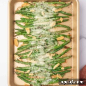 Garlic parmesan green beans baked on a tray.