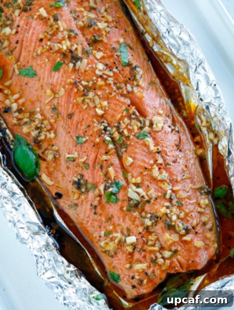 Baked Honey Garlic Salmon in foil, fresh out of the oven, golden brown and glistening