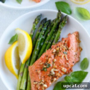 Baked Honey Garlic Salmon served with a side of veggies, pasta, or potatoes