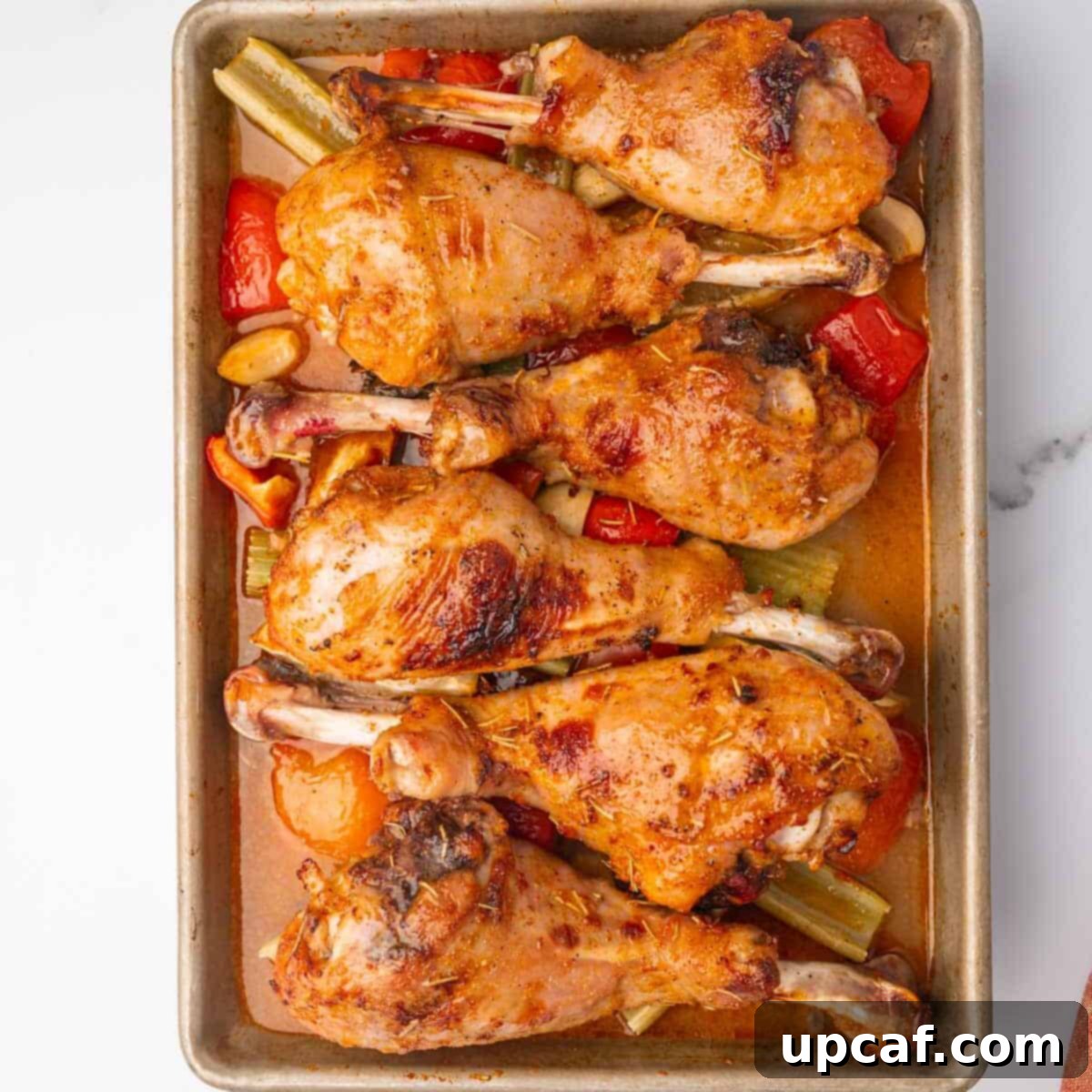 Baked turkey legs on a sheetpan after cooking.