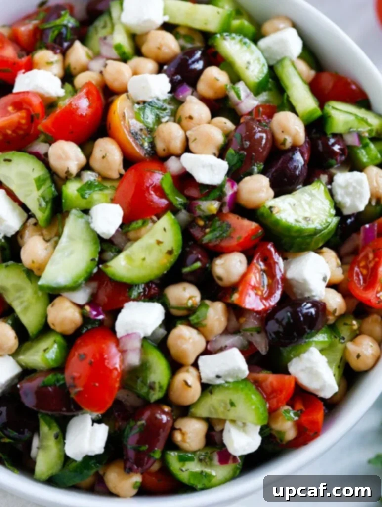 Close-up of a vibrant Greek Chickpea Salad, showcasing its fresh ingredients