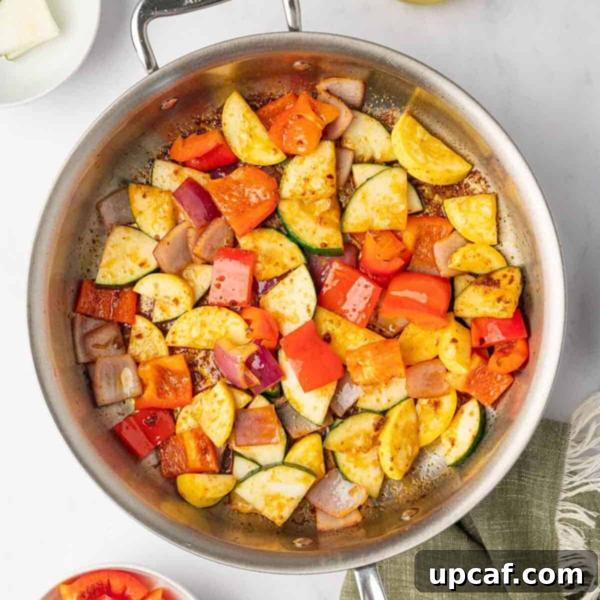 Sauteed veggies in a skillet.