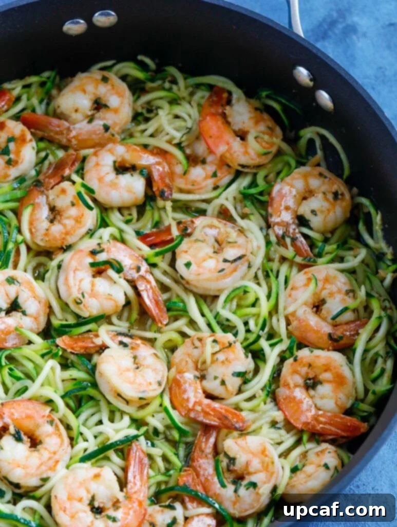 Garlic Shrimp Zoodles close-up Close-up of garlic shrimp zoodles in a skillet, ready to eat