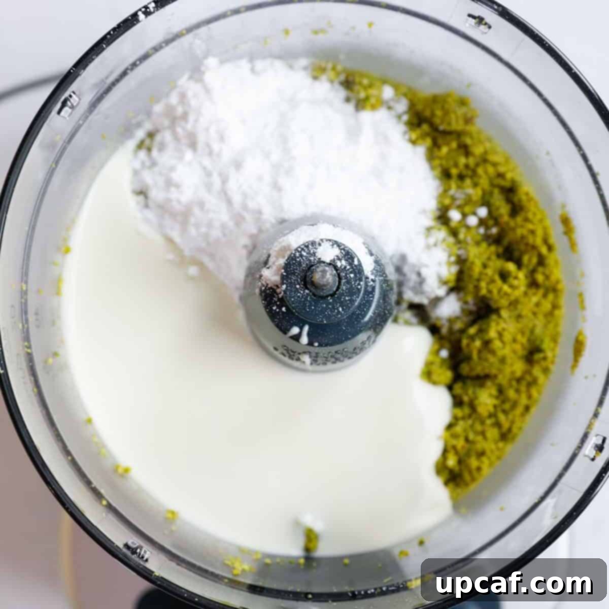 Velvety Pistachio Cream 6 Melted white chocolate and powdered sugar added to the ground pistachio and oil mixture in a food processor.