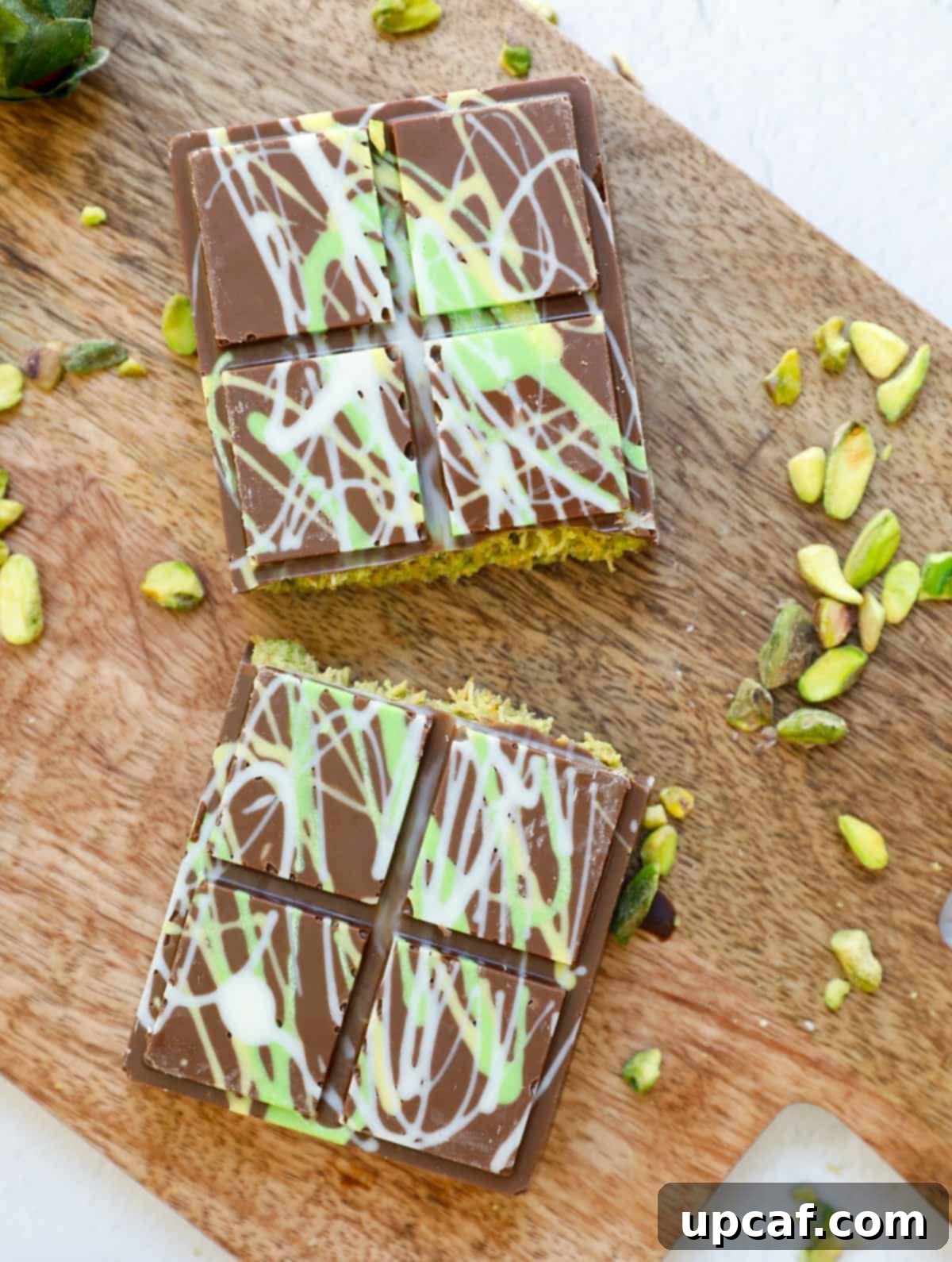 A dubai pistachio chocolate bar cut in half.