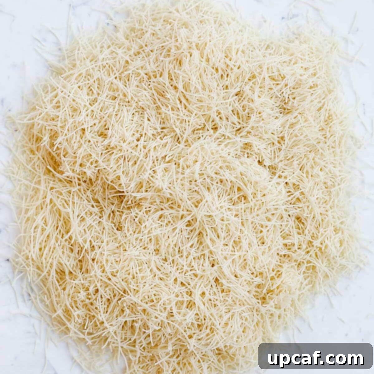 Raw shredded Kataifi dough.