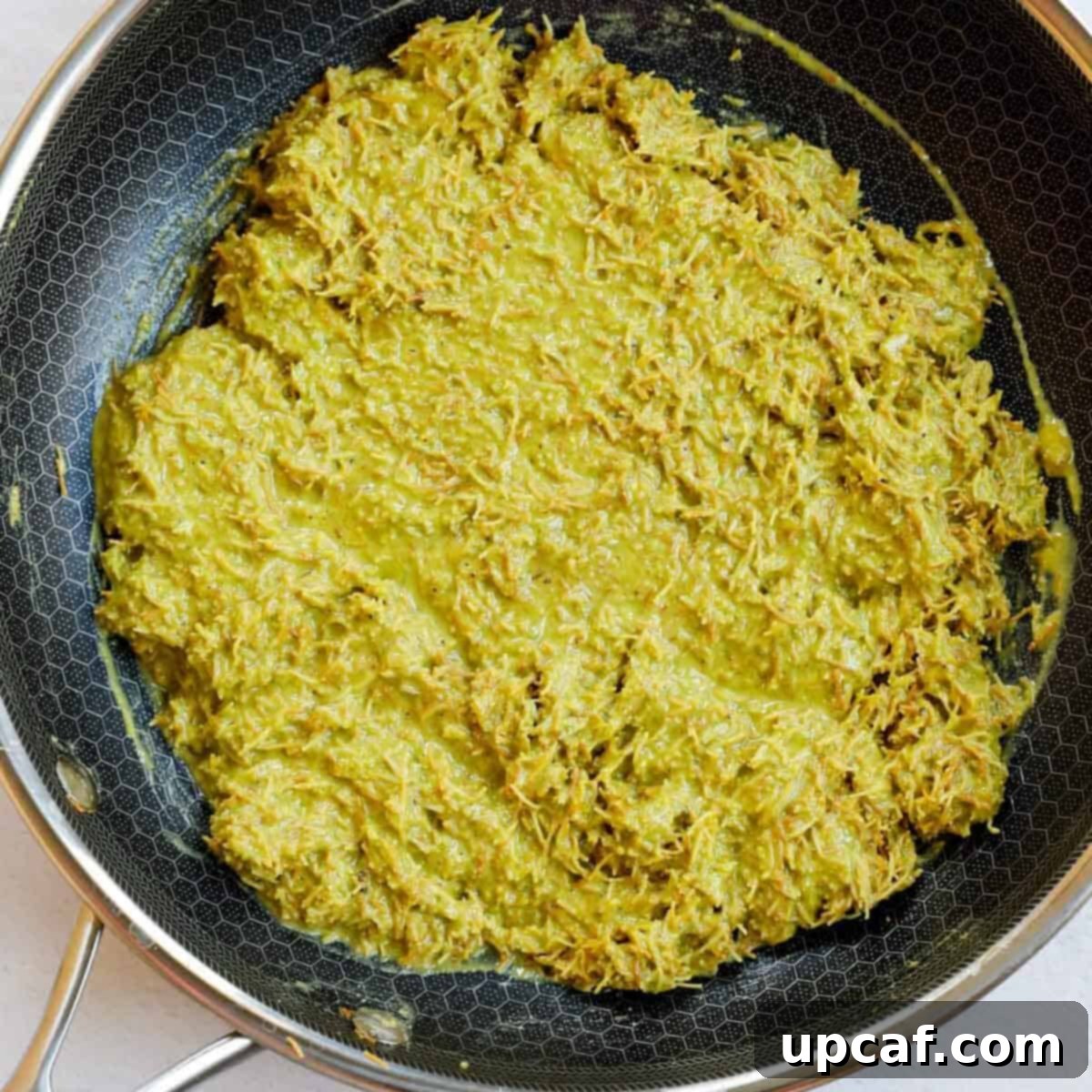Pistachio cream kunafa filling in a skillet.