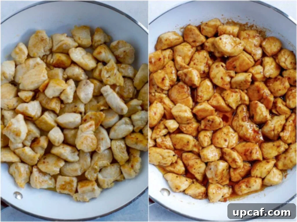 Cooking Chicken for Cashew Chicken Cubed chicken pieces searing to a golden brown in a hot skillet, ready to be tossed with the sauce and vegetables.