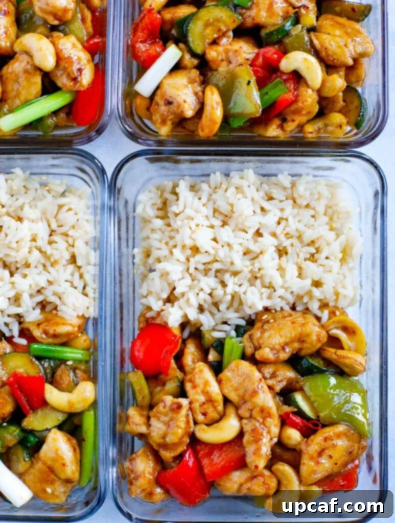 Spicy Cashew Chicken Meal Prep Individual meal prep containers filled with Spicy Cashew Chicken and a side of rice, ready for easy weeknight meals.