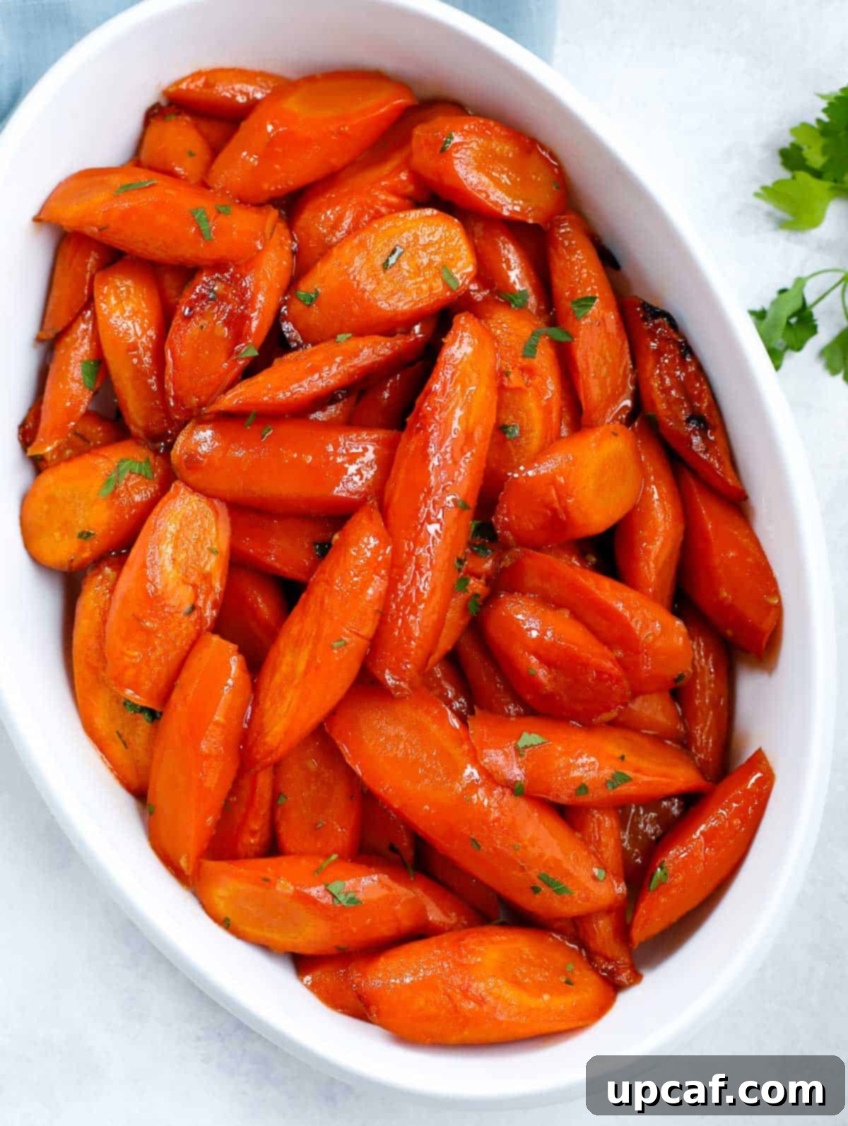 brown sugar glazed carrots on a white serving dish