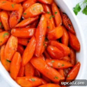 brown sugar glazed carrots in a white serving dish