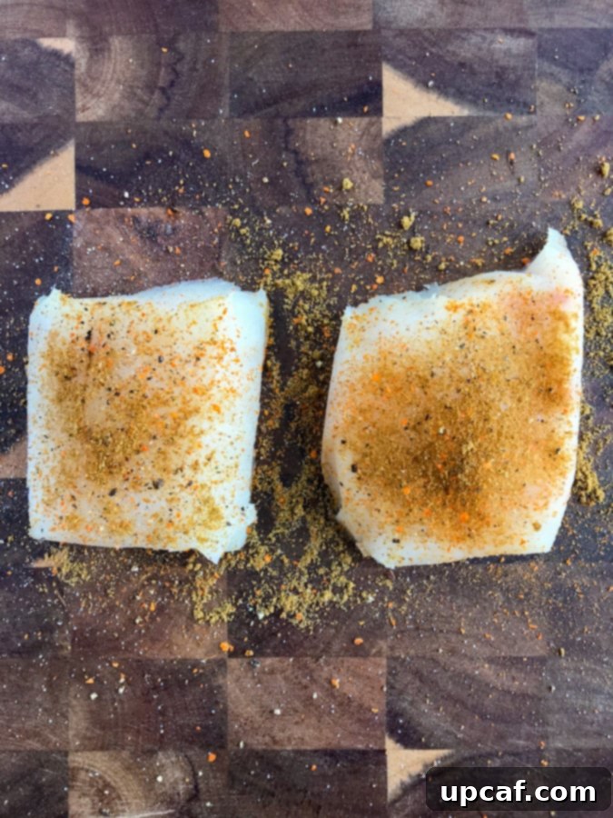 Caribbean Jerk Power Bowl 3 Marinated mahi mahi fillets on a wooden counter.