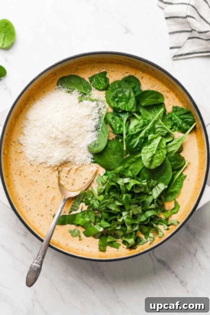 Velvety Sun-Dried Tomato Chicken Thighs 4 parmesan and spinach added to the creamy sauce