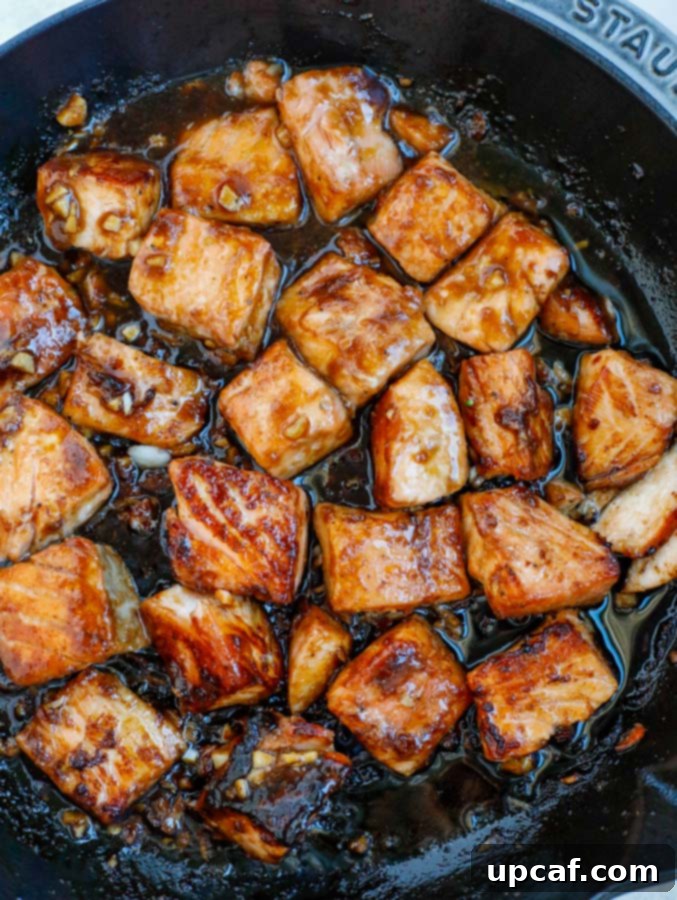 Glazed Teriyaki Salmon Medley 4 Salmon and teriyaki sauce cooking in a nonstick skillet.