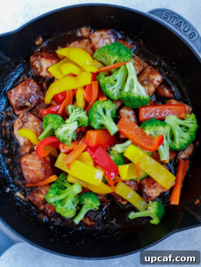 Glazed Teriyaki Salmon Medley 5 Salmon and stir fry vegetables cooking in a large nonstick skillet.