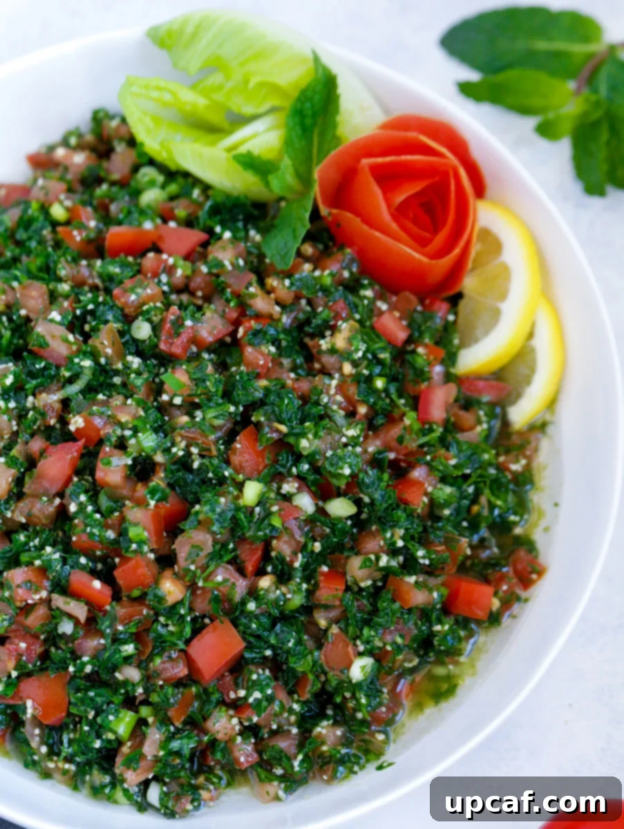 Lebanese tabbouleh garnished with sliced lemons and vegetables