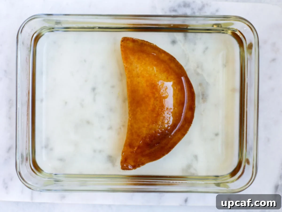 fried atayef dipped in sugar syrup