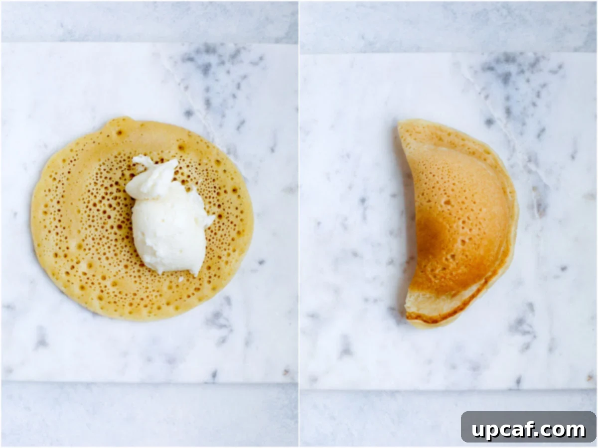 Atayef being filled with ashta and closed up.