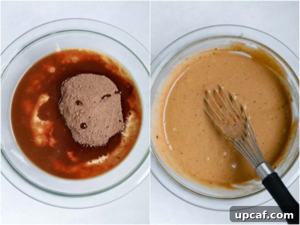 A bowl of smooth, dark chocolate pancake batter, perfectly mixed and ready to be turned into delicious mini chocolate pancakes.