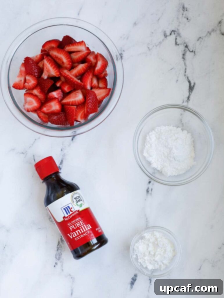 Ingredients for the strawberry crisp filling: fresh strawberries, corn starch, confectioners' sugar, and vanilla extract.