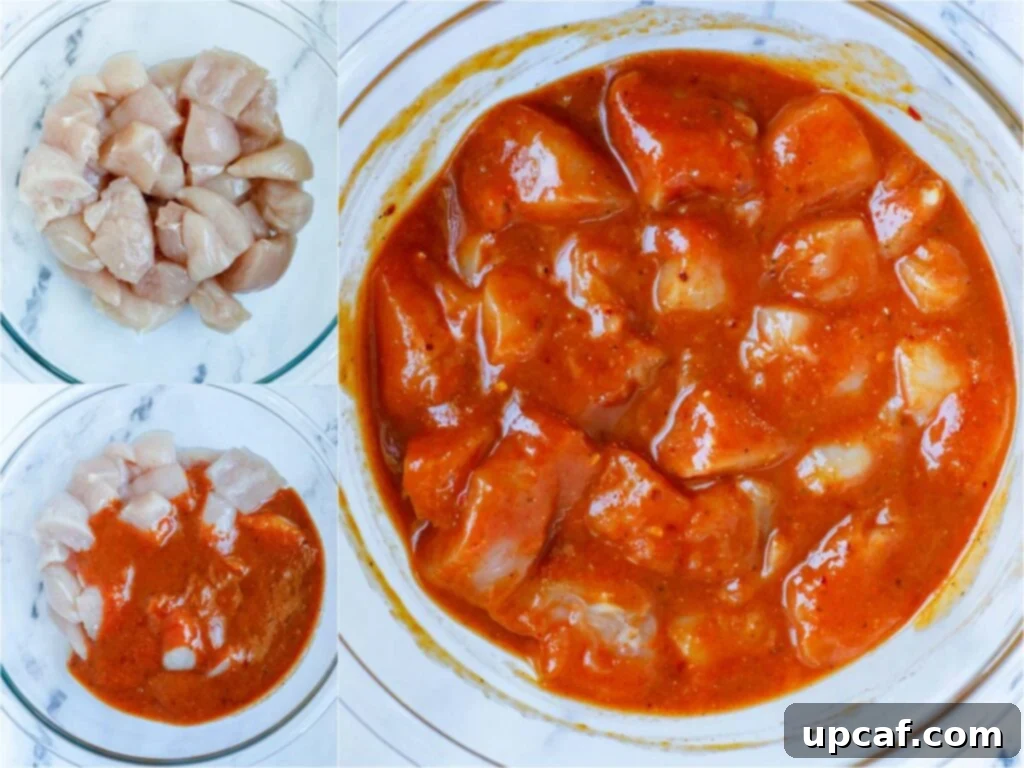 Seoul Street Chicken Skewers 5 Cubed chicken marinating in a bowl with Korean BBQ sauce