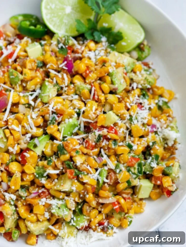 Mexican Street Corn Salad beautifully presented in a serving bowl, garnished and ready to eat.