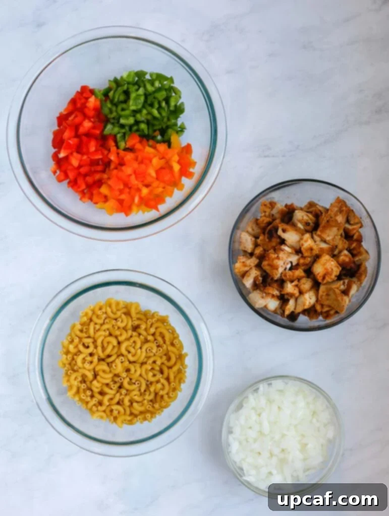 Fajita Fiesta Mac & Cheese 3 Top-down shot of various ingredients laid out for Fajita Chicken Mac and Cheese