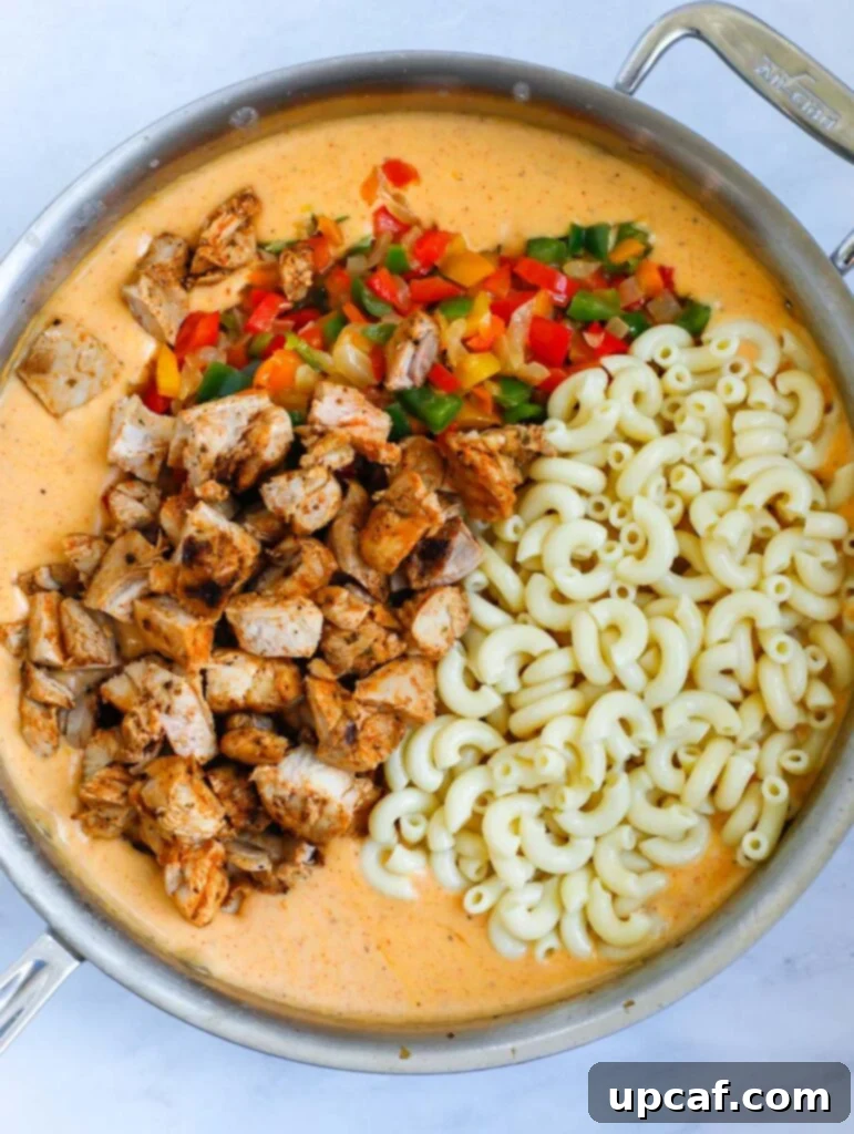 Fajita Fiesta Mac & Cheese 7 All ingredients combined in a pot, coated in the creamy sauce