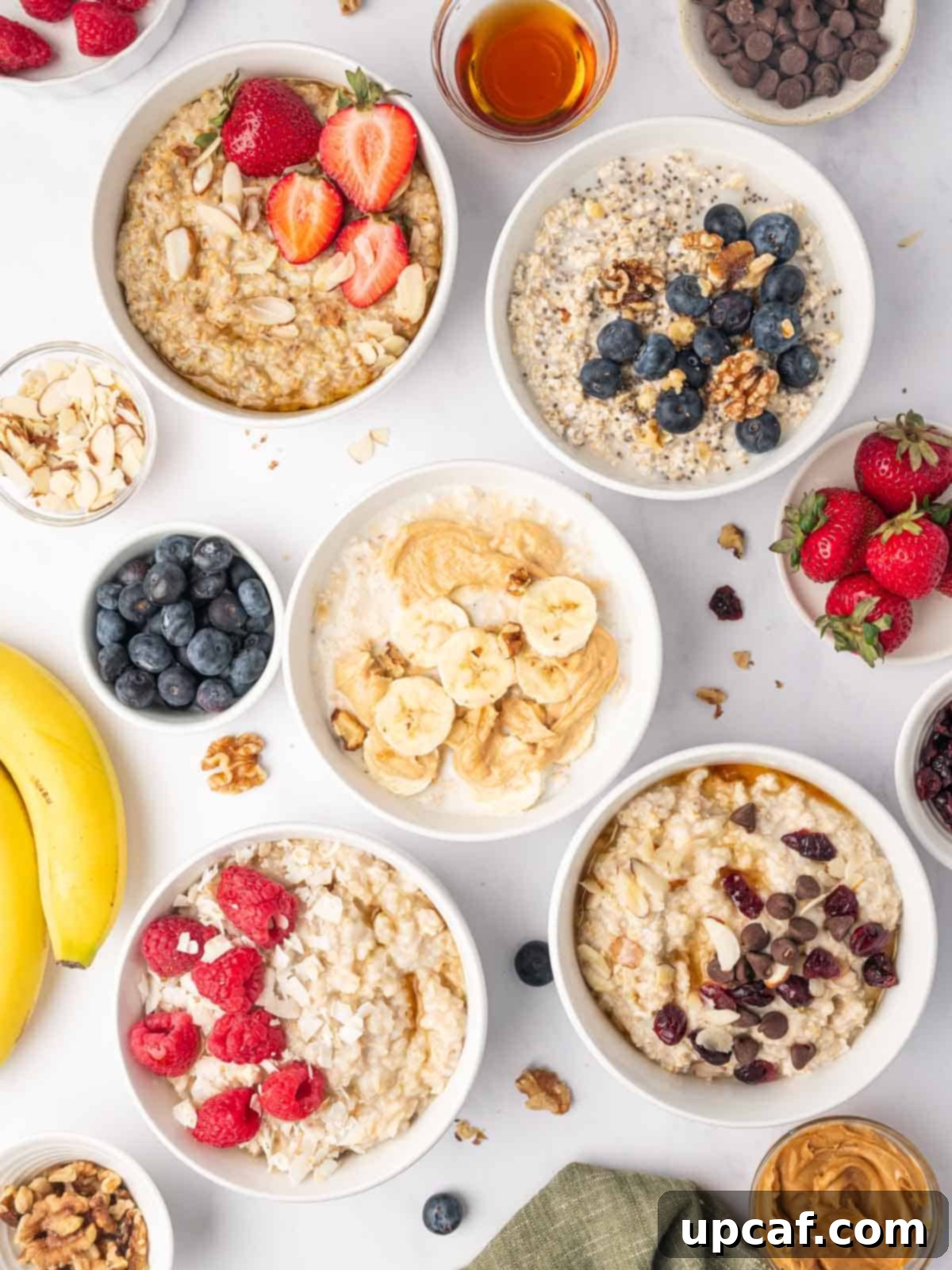 Different bowls of oatmeal prepared in different ways.