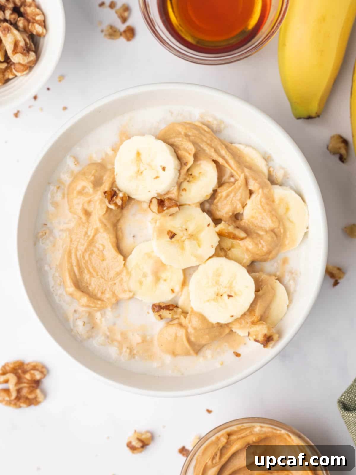 Microwaved quick oats topped with bananas and peanut butter.