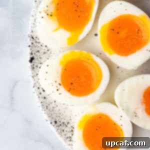 soft boiled eggs cut in half to show the runny yolk center