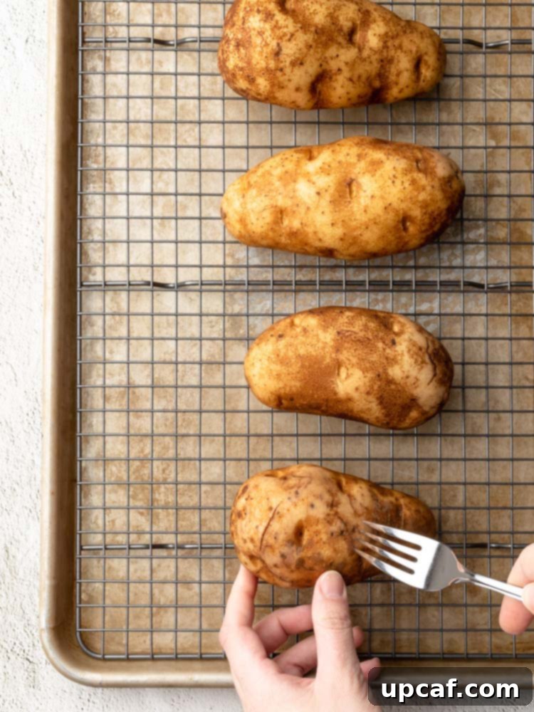 a fork being poked through a potato
