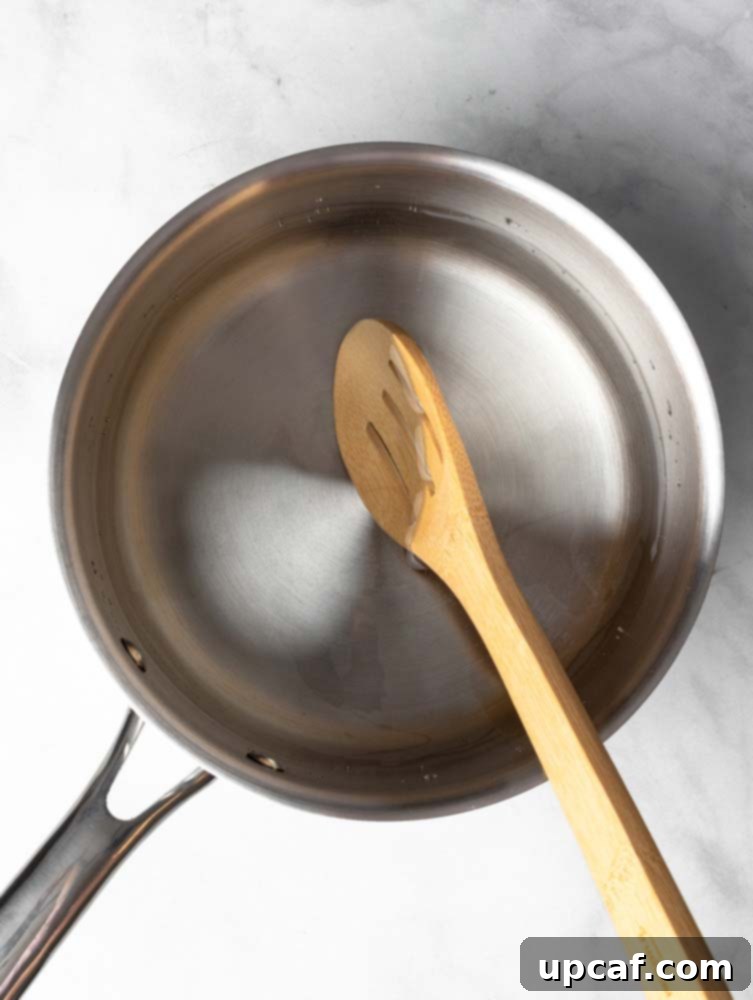 Hot water in a pot with a spoon, ready to create a whirlpool