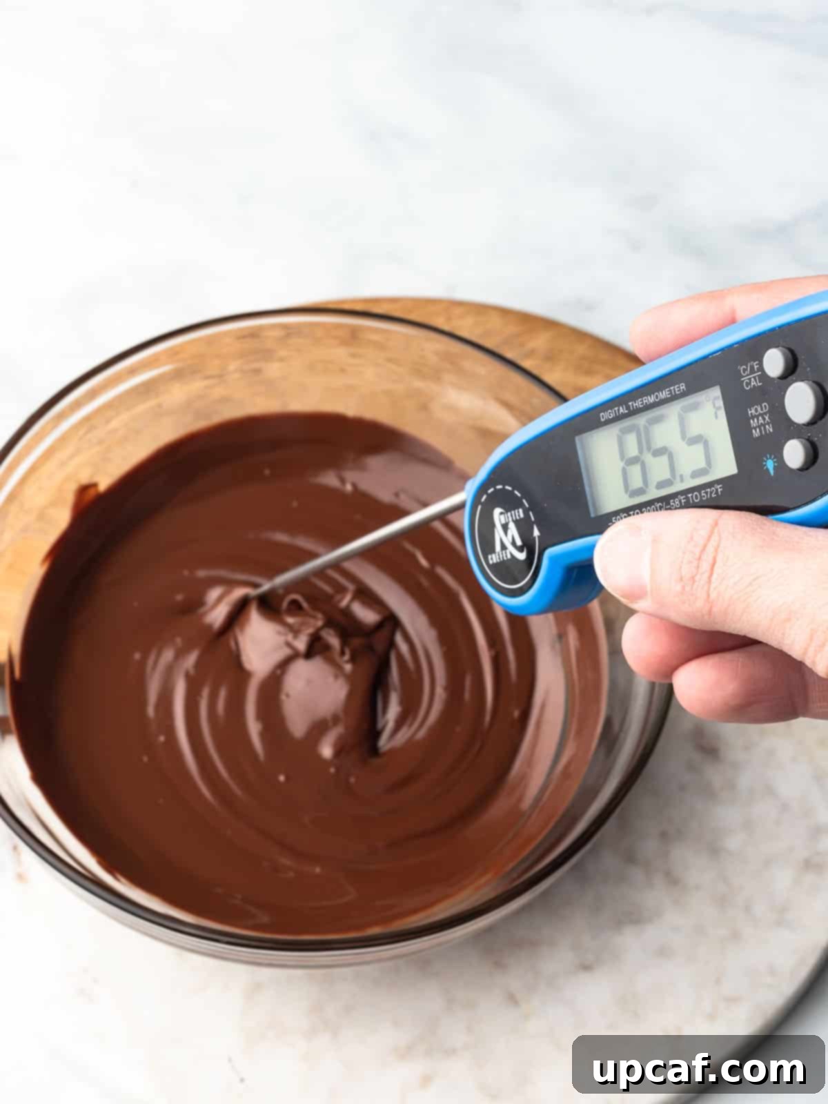 An assortment of chocolate types suitable for melting, including chips and chunks.