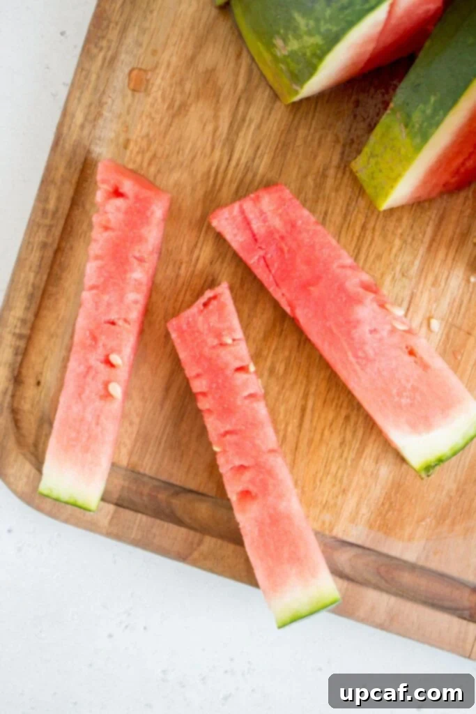 A watermelon half with the flesh detached from the rind and scored into a grid.
