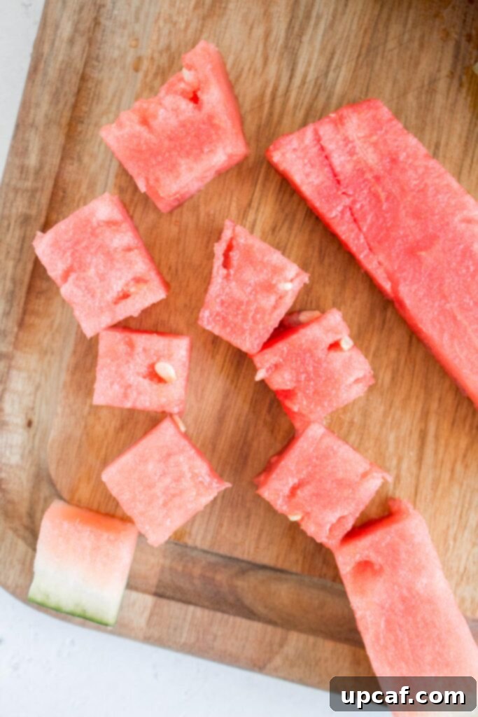 A bowl filled with freshly cut watermelon cubes.