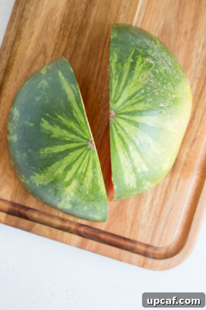 A watermelon quartered, showing four large segments.