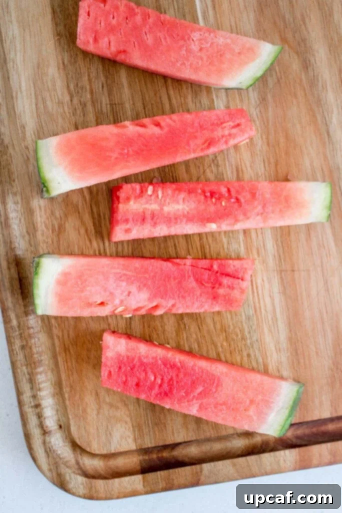 A pile of uniform watermelon sticks arranged neatly.
