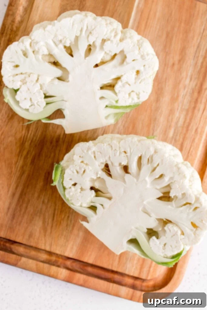Cauliflower cut neatly in half, exposing the core
