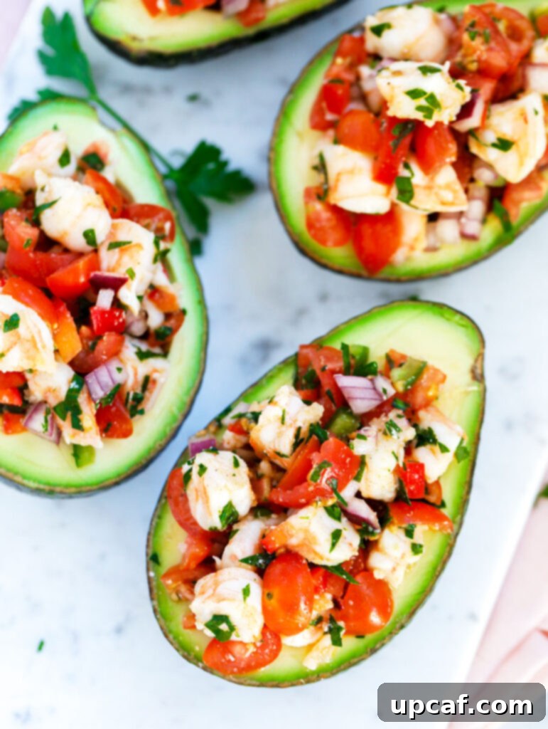 Zesty Shrimp Avocado Boats 2 A beautifully arranged top-down shot of Healthy Shrimp Stuffed Avocados in a serving dish, highlighting the vibrant colors and fresh ingredients.