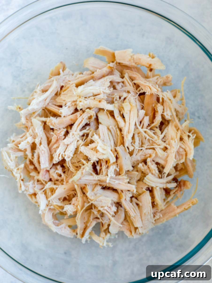 shredded chicken in a glass bowl.