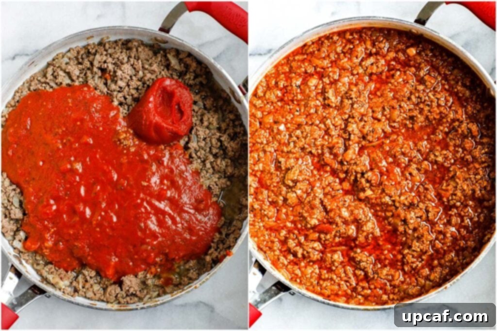 Ground beef and tomato sauce simmering in a vibrant red pot, creating the rich base for the lasagna.