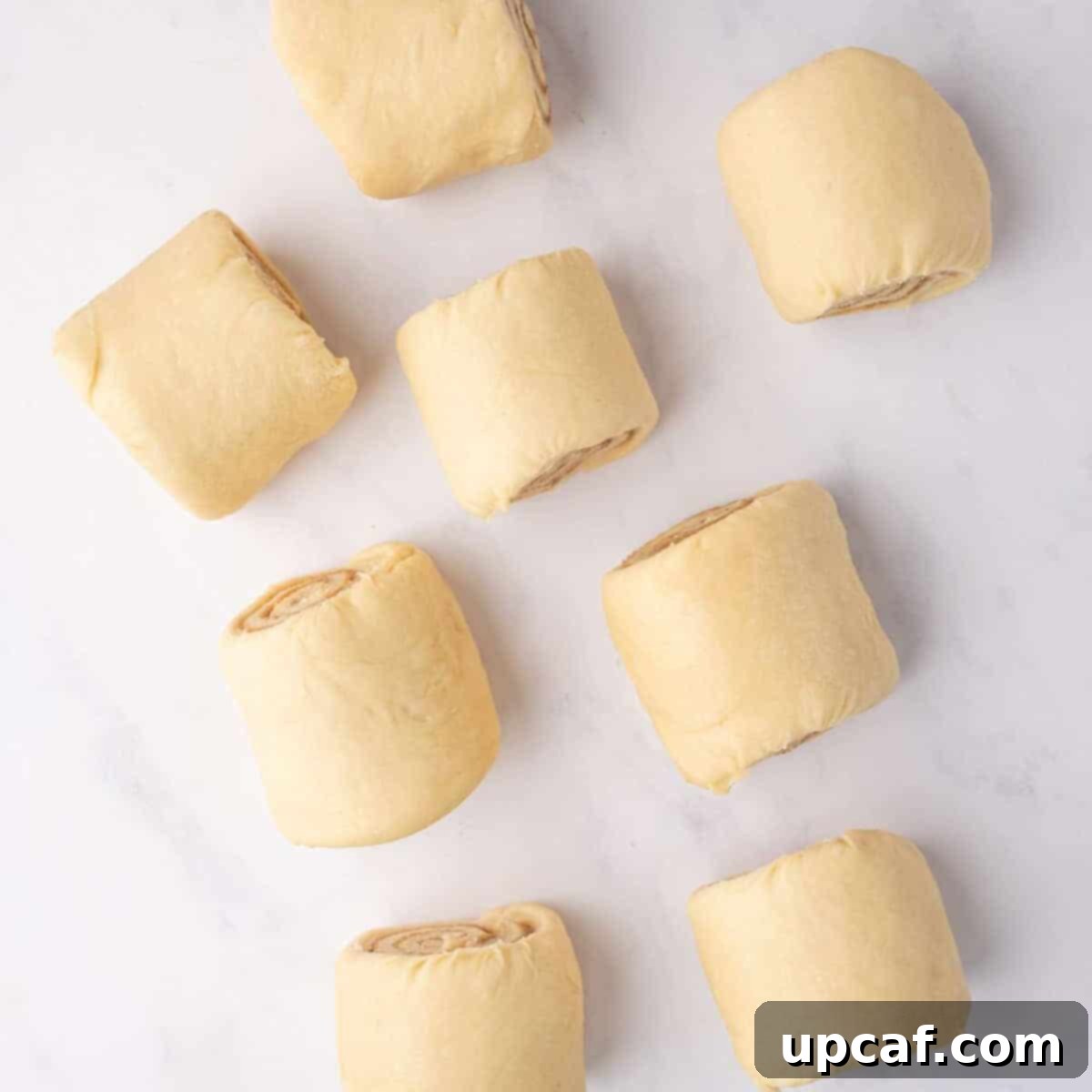 Bakery-Style Cinnamon Rolls: Extra Soft, Gooey, and Irresistibly Creamy 11 Cutting Cinnamon Rolls into Individual Pieces